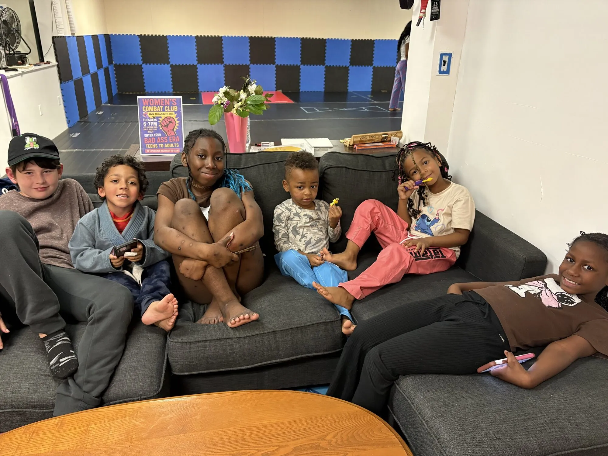 A family sitting together on a couch at the community centre